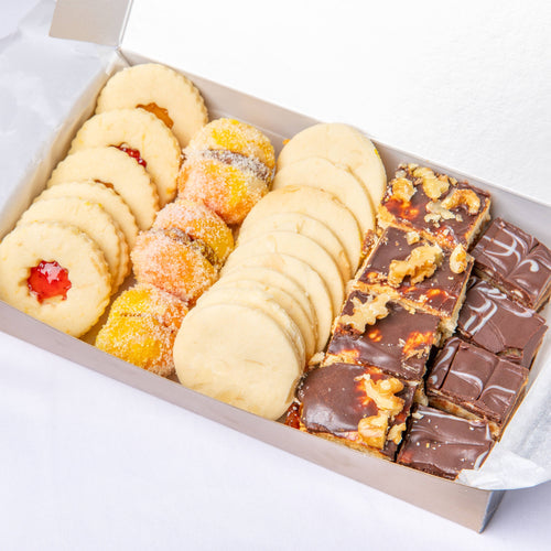 Assorted cookies neatly packed in a box, perfect for gifting or sharing.