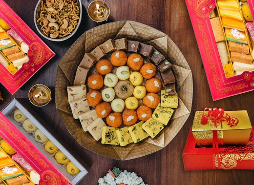 A variety of different sweets beautifully arranged on a large platter.