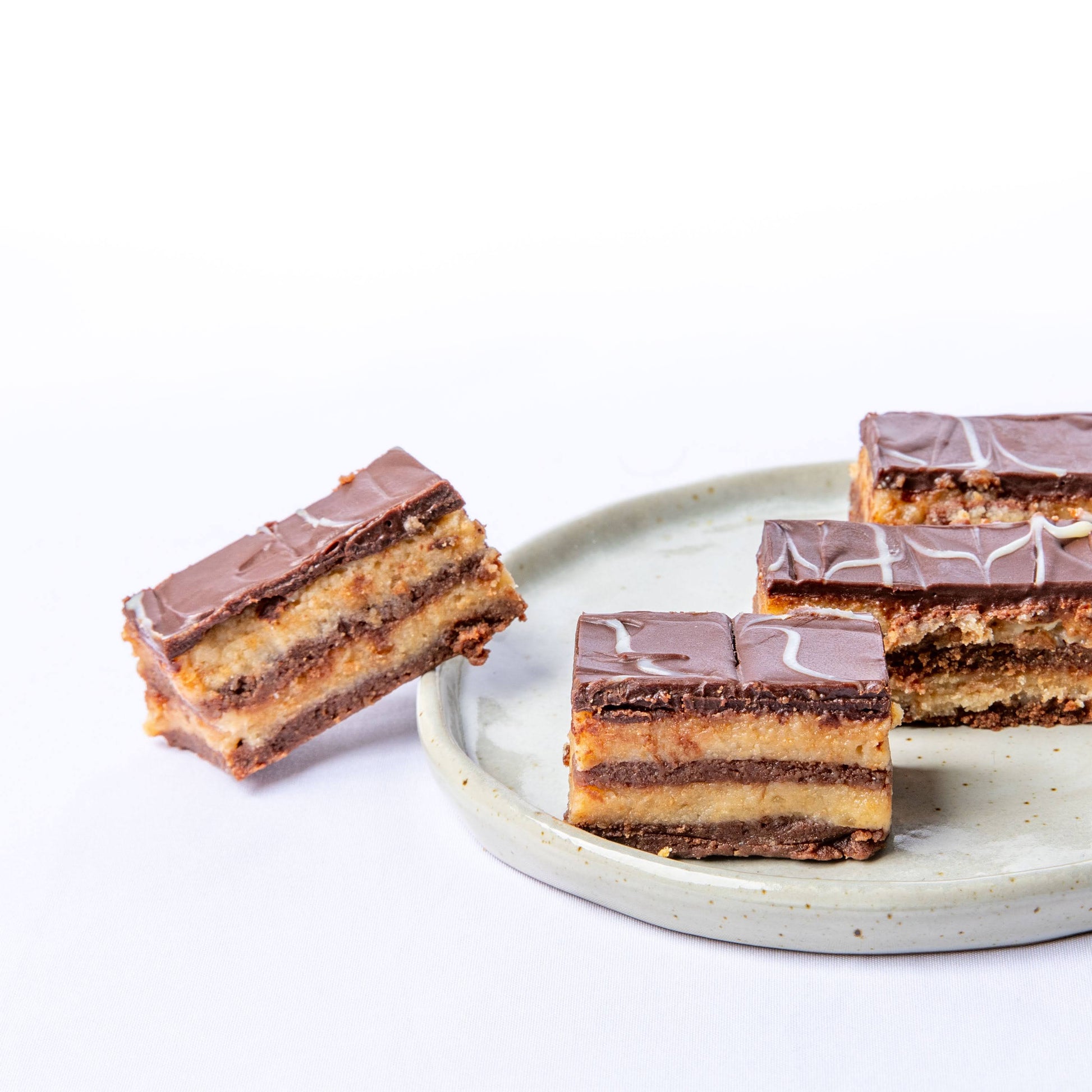 Balkan dessert Bajadera with rich chocolate and nut layers.