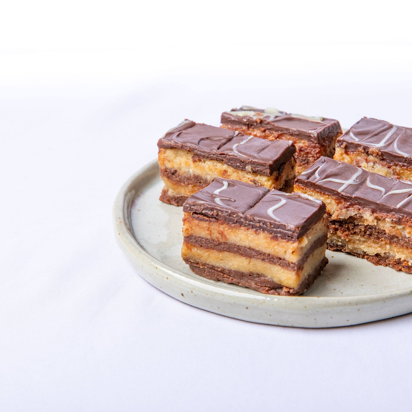 Balkan dessert Bajadera with rich chocolate and nut layers.