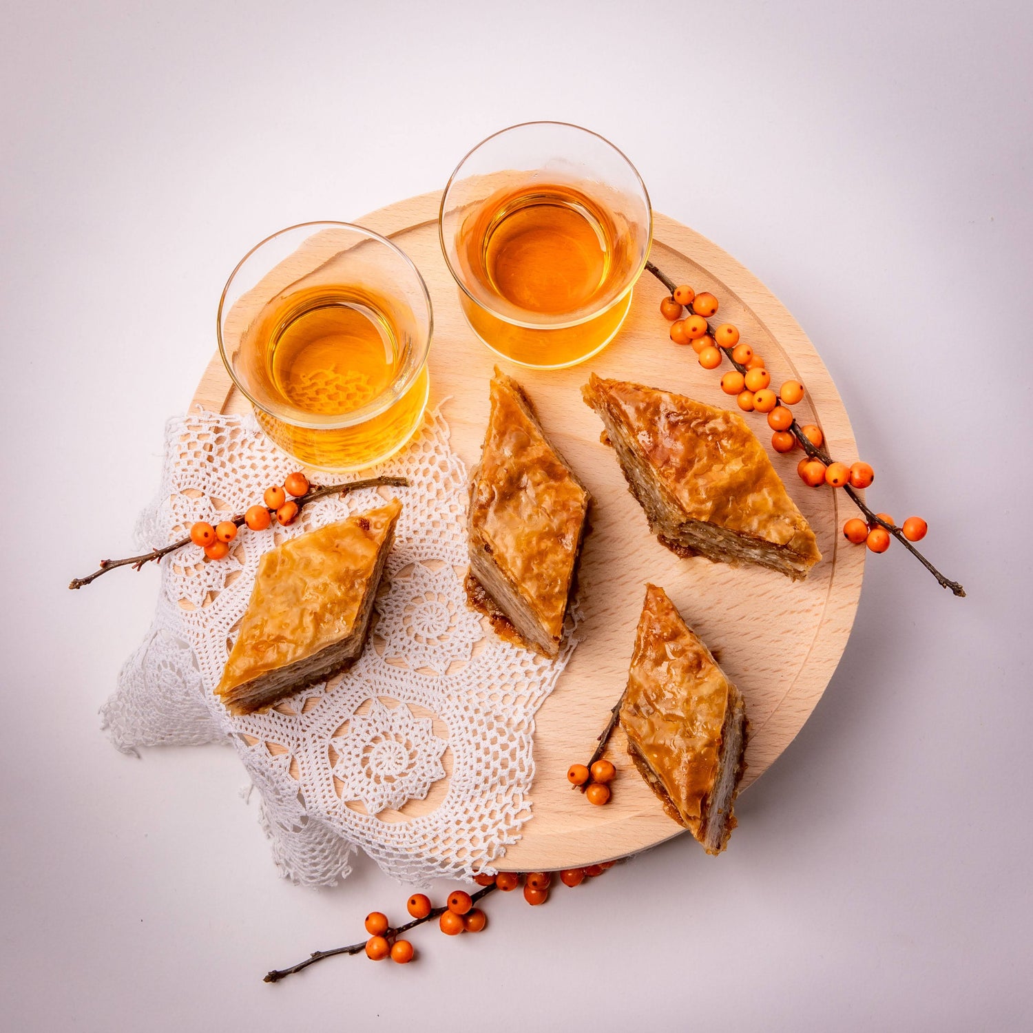 Traditional baklava served with a cup of tea, a perfect pairing.